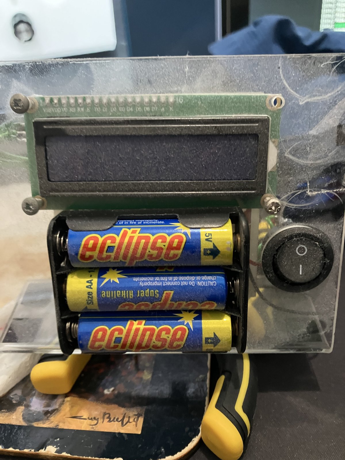 Dusty acrylic front: 1602 LCD, 3xAA pack, and rocker switch